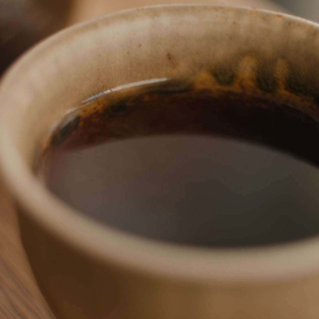Tassenfarbe von Pu Erh Mini Tuo Chas Tee in Tasse